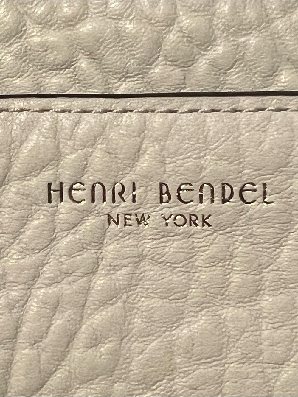 henri bendel Cream Pebbled Leather Drawstring Backpack